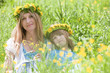 mother and son with flower wreaths