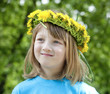 child with a flower wreath