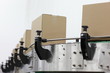 Cardboard boxes on conveyor belt in factory