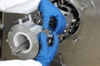 hands in gloves dealing with mech problem - details