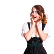 überraschte junge brünette Frau im Dirndl