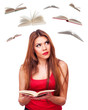 Photo: Woman and flying books Woman and flying books