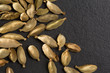 cardamom pods on black background
