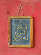 soccer tactics diagram on chalkboard, hanging on red background