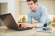 Enthusiastic man surfing the internet