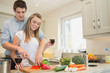 Couple drinking wine and cooking