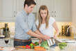 Foto: Young couple cooking together Young couple cooking together