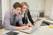 Photo: Couple watching something on the laptop Couple watching something on the laptop