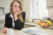 Thoughtful woman drinking coffee
