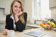Woman at morning drinking a hot beverage