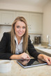 Smiling woman with tablet pc