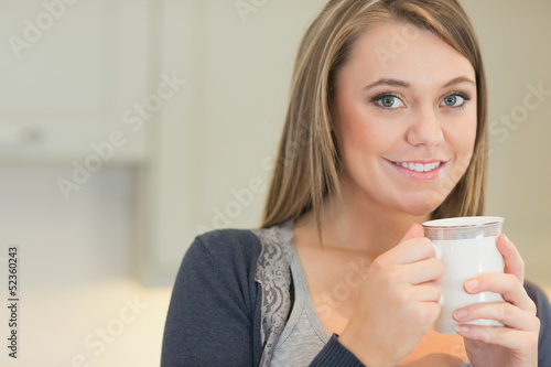Photo: Happy woman drinking coffee Happy woman drinking coffee