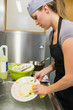 Photo: Cleaning woman washing the dishes Cleaning woman washing the dishes