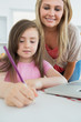 Mummy and her daughter coloring