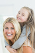 Laughing mother and daughter
