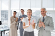 Group of business people applauding together