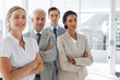 Smiling business people standing together