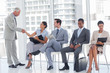 Director welcoming a businesswoman