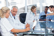Two doctors using laptop