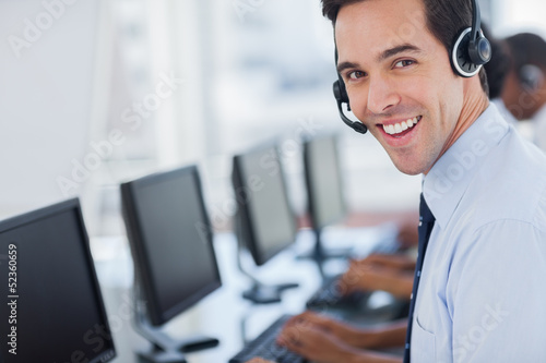 Photo: Focus on a joyful call centre agent Focus on a joyful call centre agent