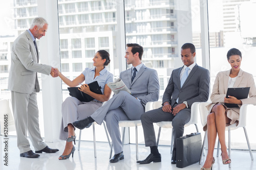 Photo: Director welcoming a businesswoman Director welcoming a businesswoman
