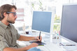 Photo: Graphic artist using graphics tablet Graphic artist using graphics tablet