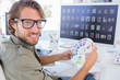 Photo editor looking at colour wheel and turning to smile