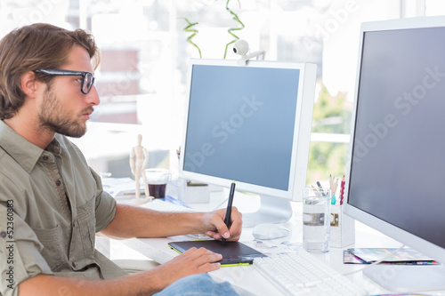 Photo: Graphic artist using graphics tablet Graphic artist using graphics tablet