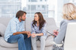 Couple looking to each other during therapy session