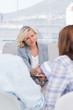 Therapist giving tissue to the wife