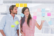 Young man and woman brainstorming together