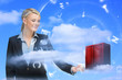 Photo: Businesswoman touching data server tower Businesswoman touching data server tower