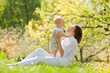Happy Mother and her child enjoy the summer