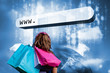 Photo: Girl with shopping bags looking at address bar with data servers Girl with shopping bags looking at address bar with data servers