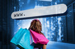 Photo: Girl holding shopping bags looking at address bar Girl holding shopping bags looking at address bar