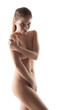 Portrait of young smiling girl posing naked