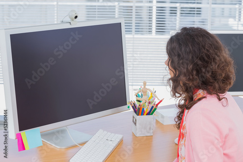 Photo: Woman working in creative office Woman working in creative office