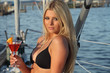 Girl having a drink on a boat