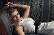 Beautiful woman seated on a sofa