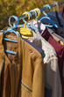 clothes and leather jacket displayed at garage sale