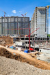 Construction of new dwelling house. Red construction crane.
