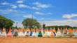 Thai traditional cemetery statues against blue sky