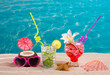 Mojito and strawberry cocktail on white sand beach