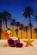 Coconut cocktail on tropical  sand beach heart sunglasses