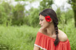 portrait of a beautiful lonely girl with a flower in her hair