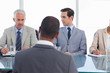 Business people asking questions during a job interview