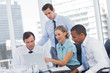 Four business people in a meeting room