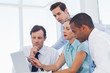 Business team watching a laptop
