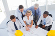 Architects looking at blueprints
