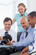 Business people looking at a camera